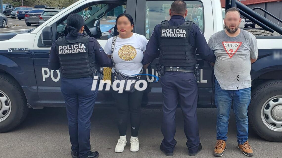 Detienen a pareja robando autopartes en centro comercial de Querétaro